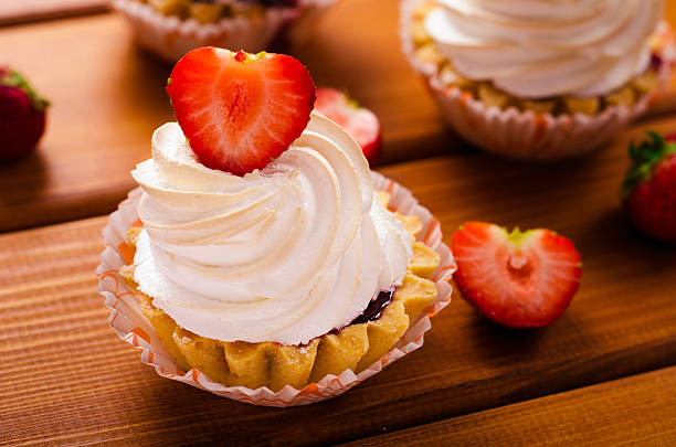 istock cake with white cream and fresh strawberries on table 479641664