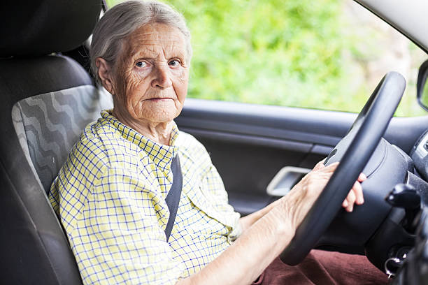 istock Senior woman driving a car 479643874
