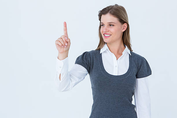istock Smiling woman pointing something with her finger 479646208