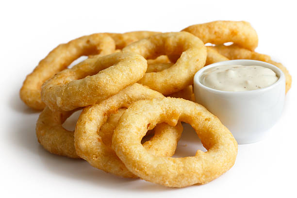istock Pile of deep fried onion or calamari rings. 479647040