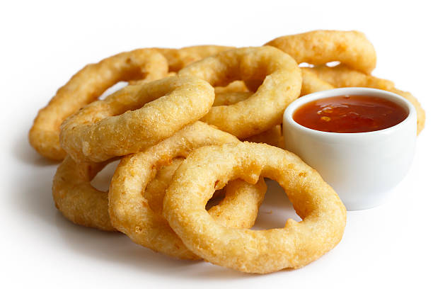istock Pile of deep fried onion or calamari rings. 479647044