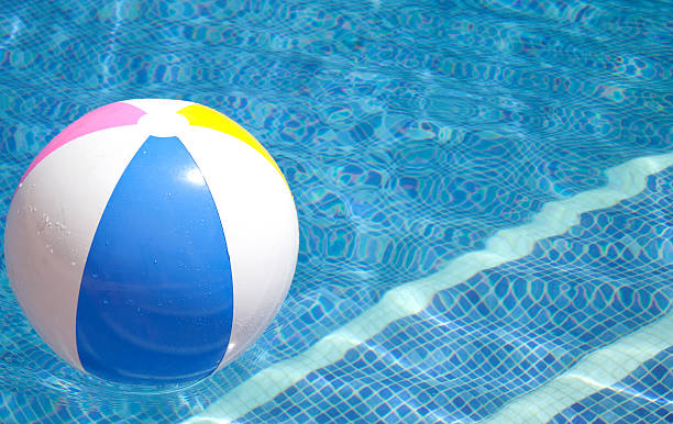 istock Ball floating in a blue swimming pool 479652076