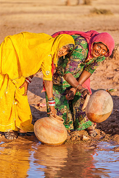 istock Indian women collecting water, Rajasthan 479652106