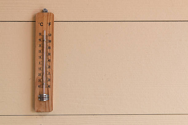 istock thermometer on wood background 479652546