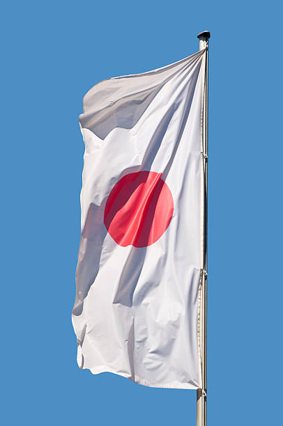 Japan flag in front of a blue sky