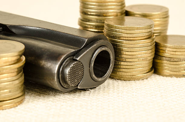 istock Gun and money 479653350