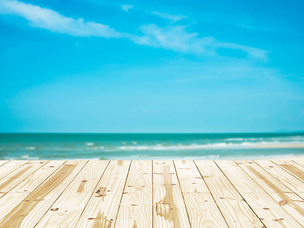 istock Wood table top on sea beach blurry backgrounds. 479658206