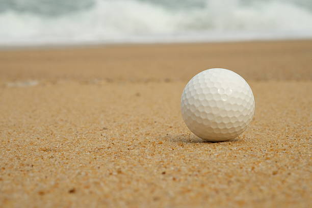 istock golf ball in sand trap - Stock image 479659234