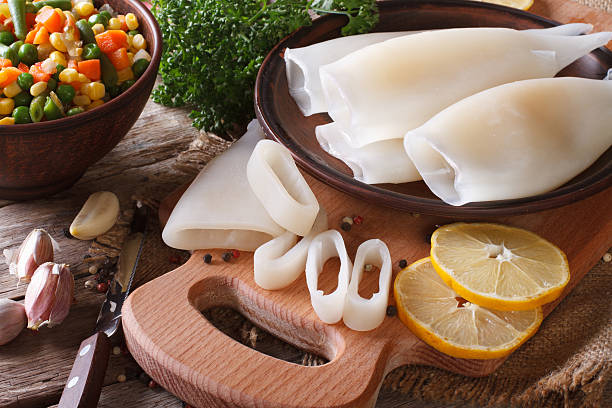 istock Preparation of raw squid and ingredients close-up. Horizontal 479659456