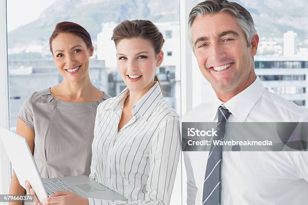 Businesswoman Using Laptop At Work Stock Photo - Download Image Now - 18-19 Years, 30-39 Years, 35-39 Years