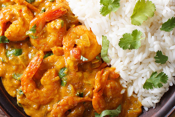 istock Shrimps in curry sauce and rice macro. horizontal top view 479661022