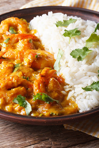 istock Shrimps in curry sauce with rice and cilantro vertical 479661168