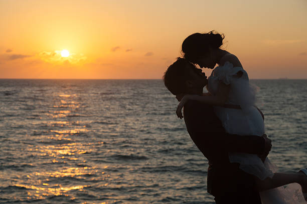 istock Couple standing by the sea 479663622