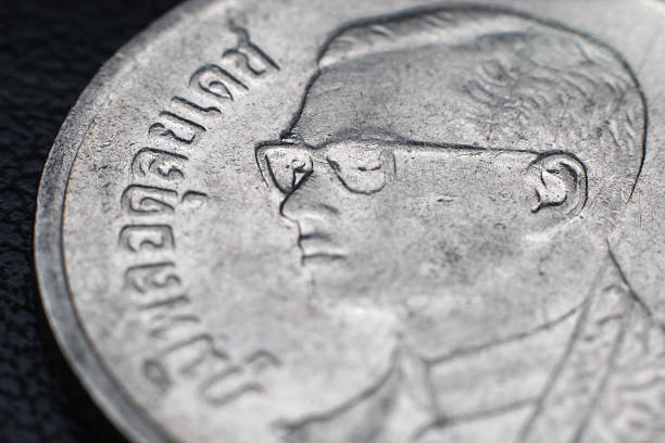 istock close up thai baht coin on black background 479667827