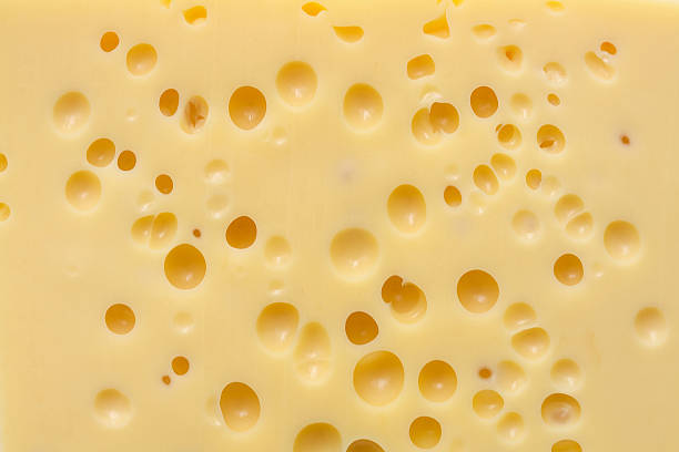 trama di formaggio emmental - swiss cheese foto e immagini stock