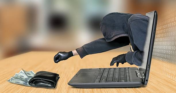 istock Hacker - thief steals money from laptop 479676166