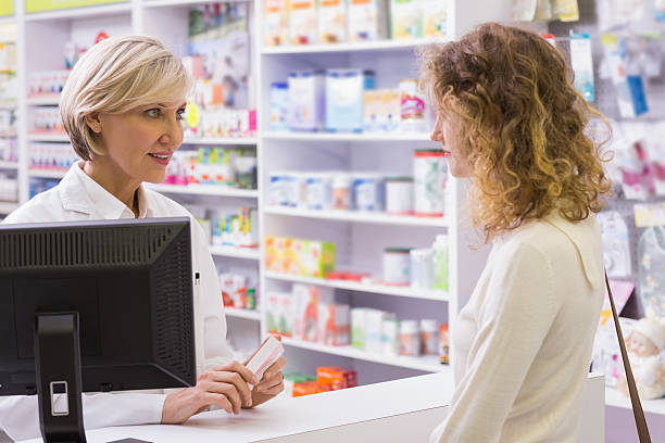 istock Pharmacist explaining the drug to patient 479678064