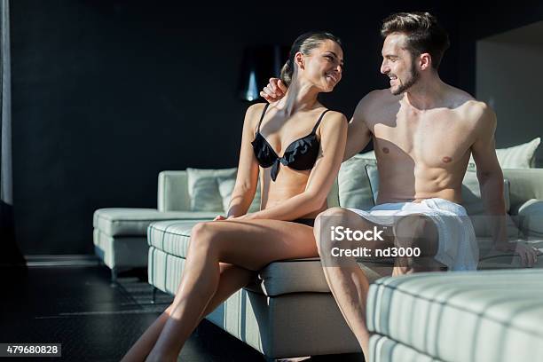 Beautiful Couple Being In Love On Their Honeymoon In Hotel Stock Photo - Download Image Now
