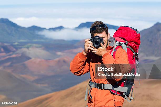 Nature Photographer Taking Pictures Outdoors Stock Photo - Download Image Now - Adult, Blue, Camera - Photographic Equipment