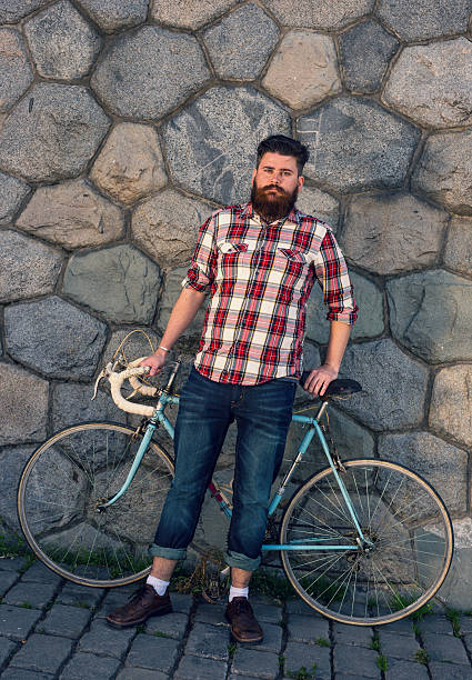 istock Trendy hipster young man with bycicle 479688260