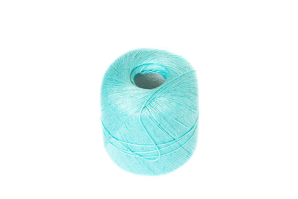 istock Turquoise knitting thread ball isolated on white 479688598