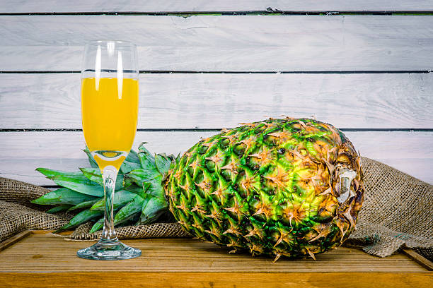 istock Pineapple and juice on a wooden table 479689460