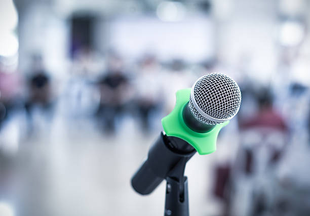 istock Close up of microphone in conference room on blurred background 479693016