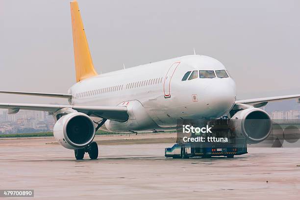 Airplane In Airport Traffic Human Transportation Vehicle Stock Photo - Download Image Now