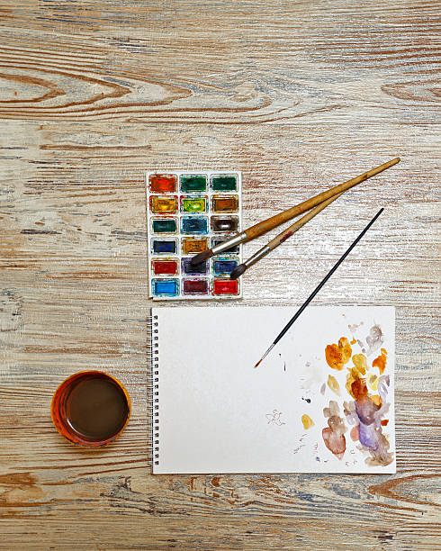 istock Paints, brushes and sketch pad on the table. 479705080