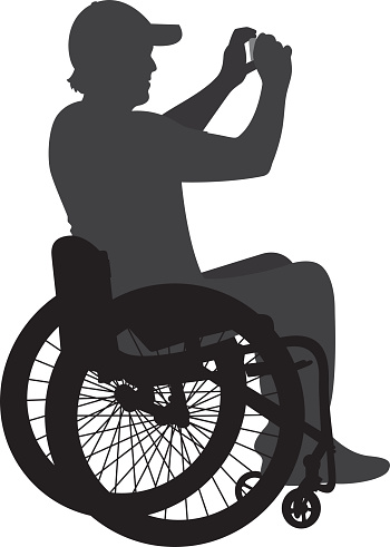Vector silhouette of a man in a wheelchair holding a camera and taking a picture.