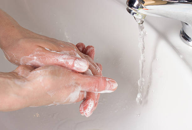 istock woman washing her hands 479712934