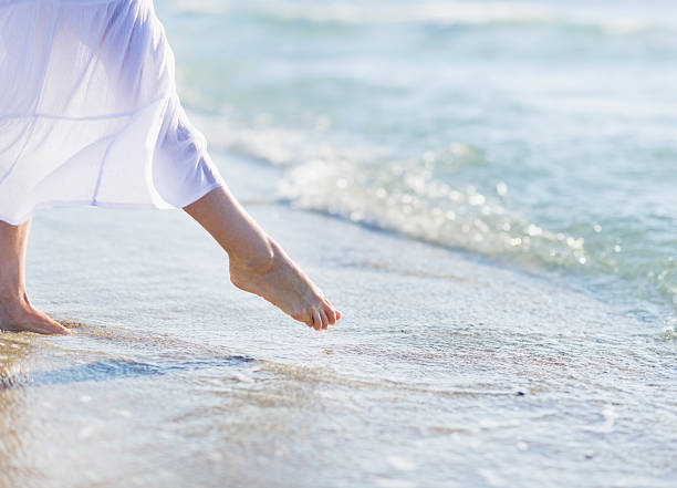 istock Young woman standing on sea shore. Closeup 479716133