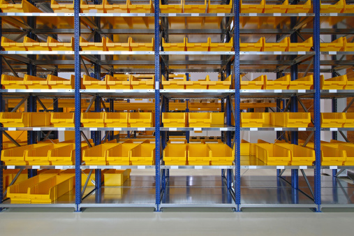 Storage bins and trays in distribution warehouse