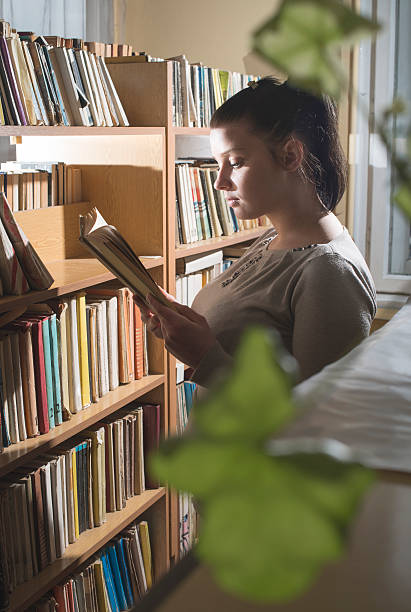 istock Young women in a vintage library 479718374