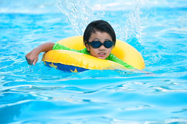istock Asian boy in tube learning to swim 479720145
