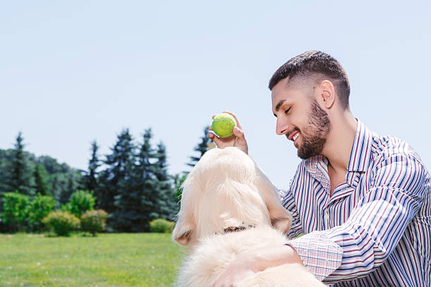 istock Happy man with his golden retriever 479721558