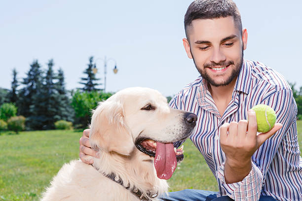 istock Happy man with his golden retriever 479721570