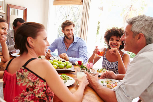 istock Friends sitting at a table talking during a dinner party 479724650