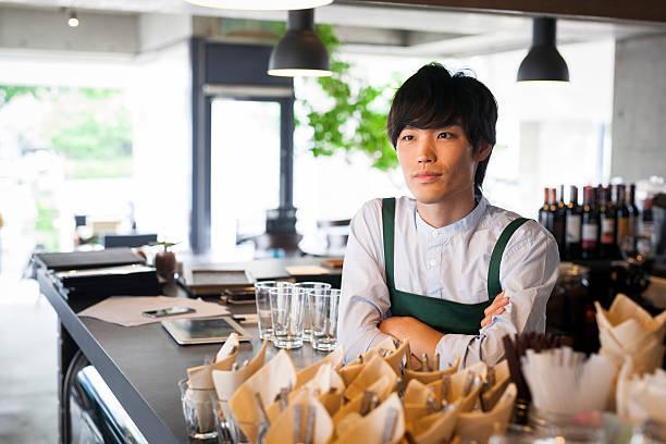 istock Handsome asian waiter in a restaurant 479726072