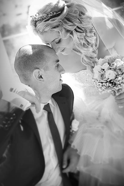 istock happy groom and the bride sit at a window 479726604