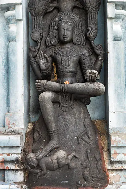 Sri Dakshinamurthy, the avatar of Lord Shiva, as a teacher-guru, who brings knowledge and takes ignorance away. At Rathinagiri Hill Temple in Vellore, Tamil Nadu, India.