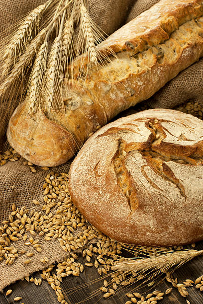 istock Assortment of baked bread on wood table 479729387