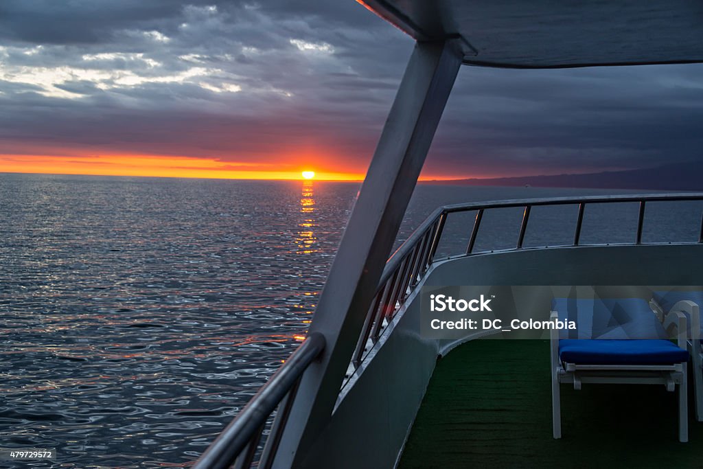Sunset from a Ship in Galapagos Red and orange sunset as seen from the deck of a ship in the Galapagos Islands in Ecuador 2015 Stock Photo