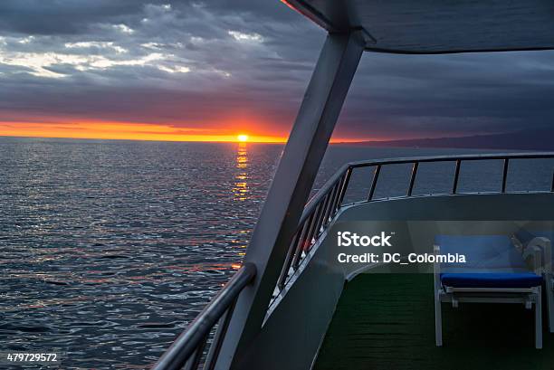 Sunset From A Ship In Galapagos Stock Photo - Download Image Now - 2015, Blue, Boat Deck