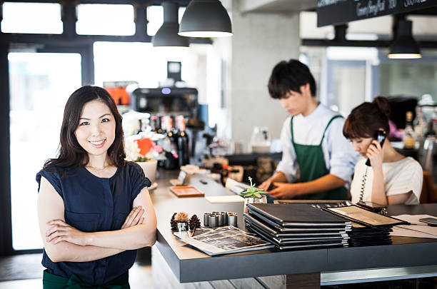istock Asian restaurant owner and her employees 479730226