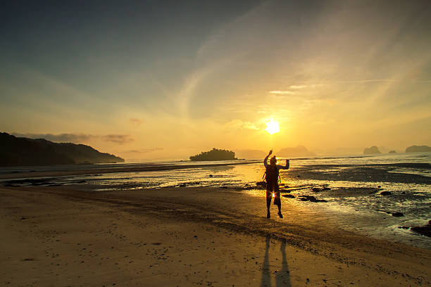 istock silhouette Man and sunset on the beach Vacation holidays 479738798