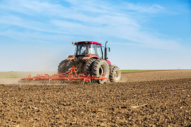 istock Farmer in tractor preparing land with seedbed cultivator 479741398