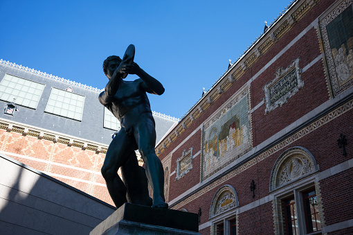 Amsterdam, Netherlands - July 23, 2014: The statue of a discus thrower in  the Rijksmuseum courtyard