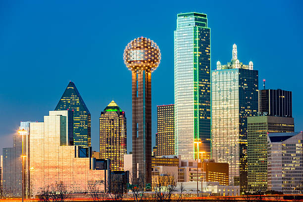 Dallas skyline at sunset Dallas skyline at sunset under a clear blue sky. reunion tower photos stock pictures, royalty-free photos & images