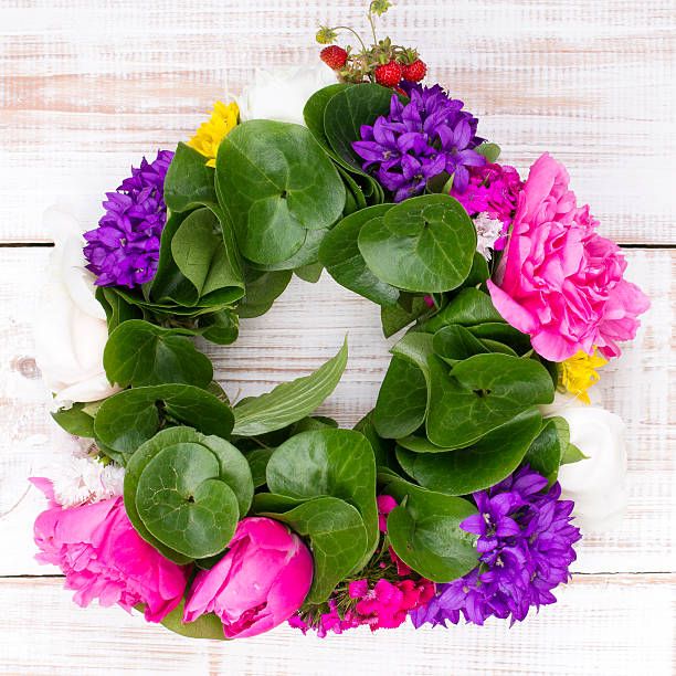istock Flower wreath decoration on wood. 479762816